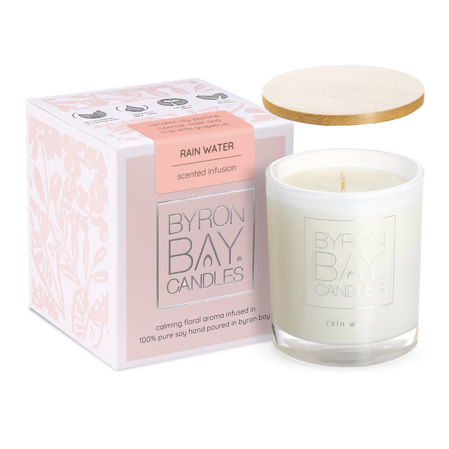 Rain Water medium soy candle, 75x75x85mm jar in soft neutral tones, hand-poured with 100% pure soy wax and cotton wick. Features floral and citrus scent with 30+ hours burn time, natural timber lid, and gift box.