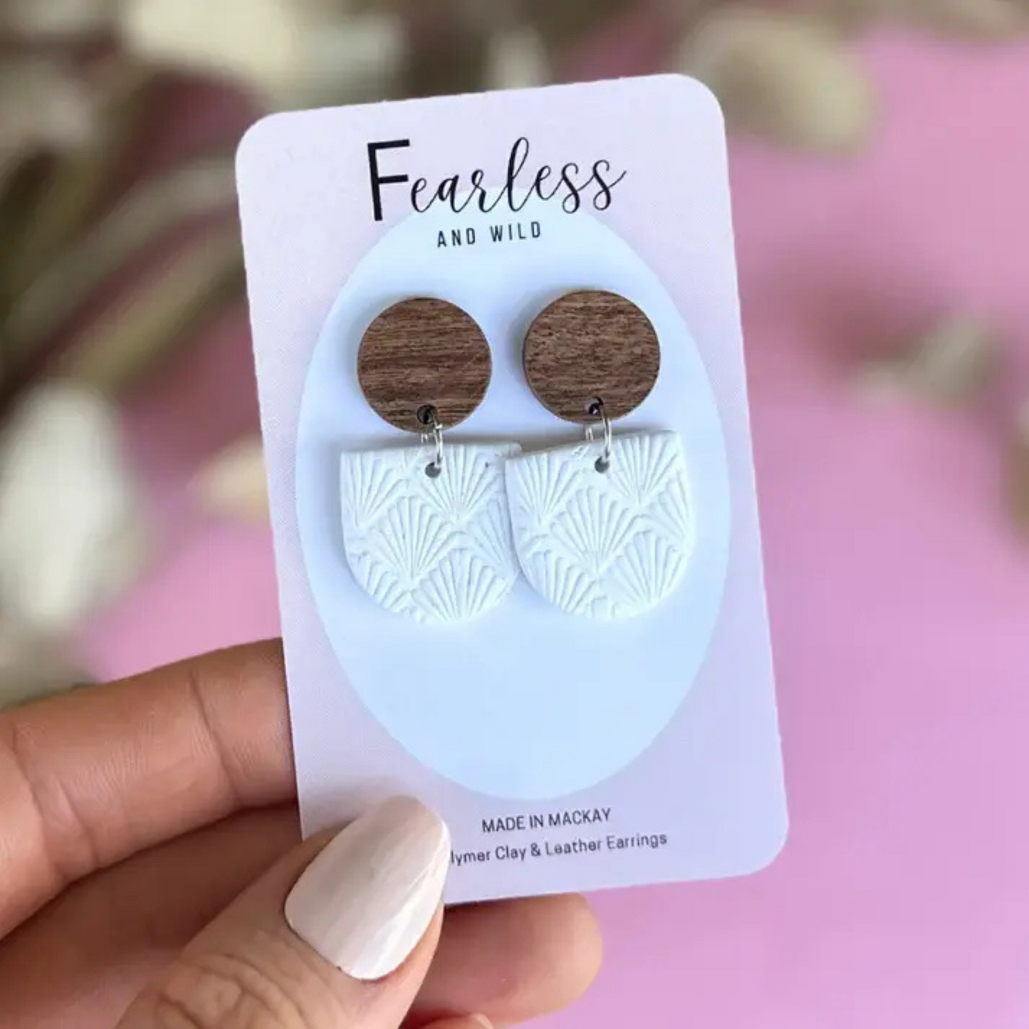 Handmade white geometric dangle earrings crafted from polymer clay with stainless steel posts—lightweight, chic, and ideal for sensitive ears.