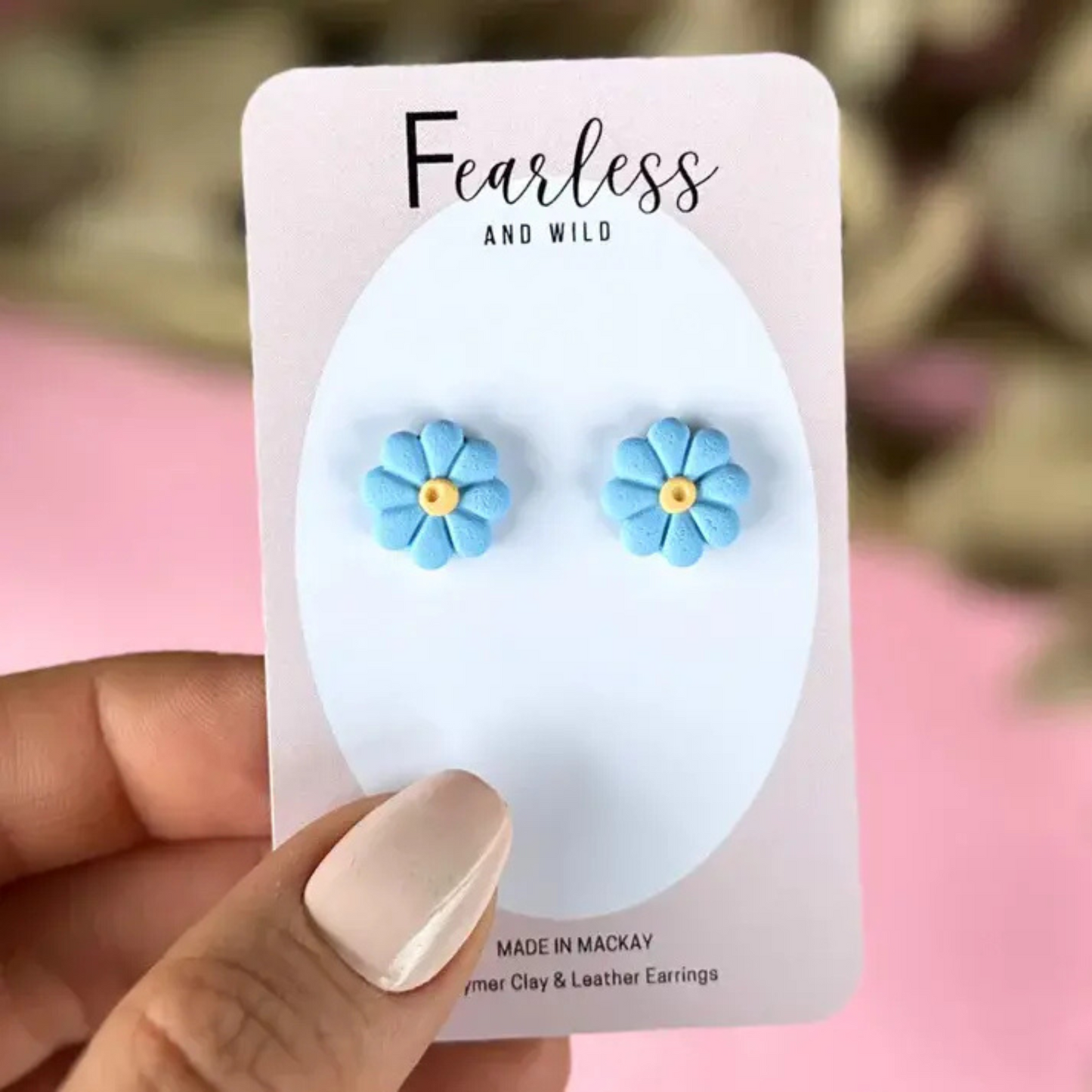 Soft blue flower stud earrings made from polymer clay with stainless steel posts—petite, lightweight, and perfect for sensitive ears and everyday wear.