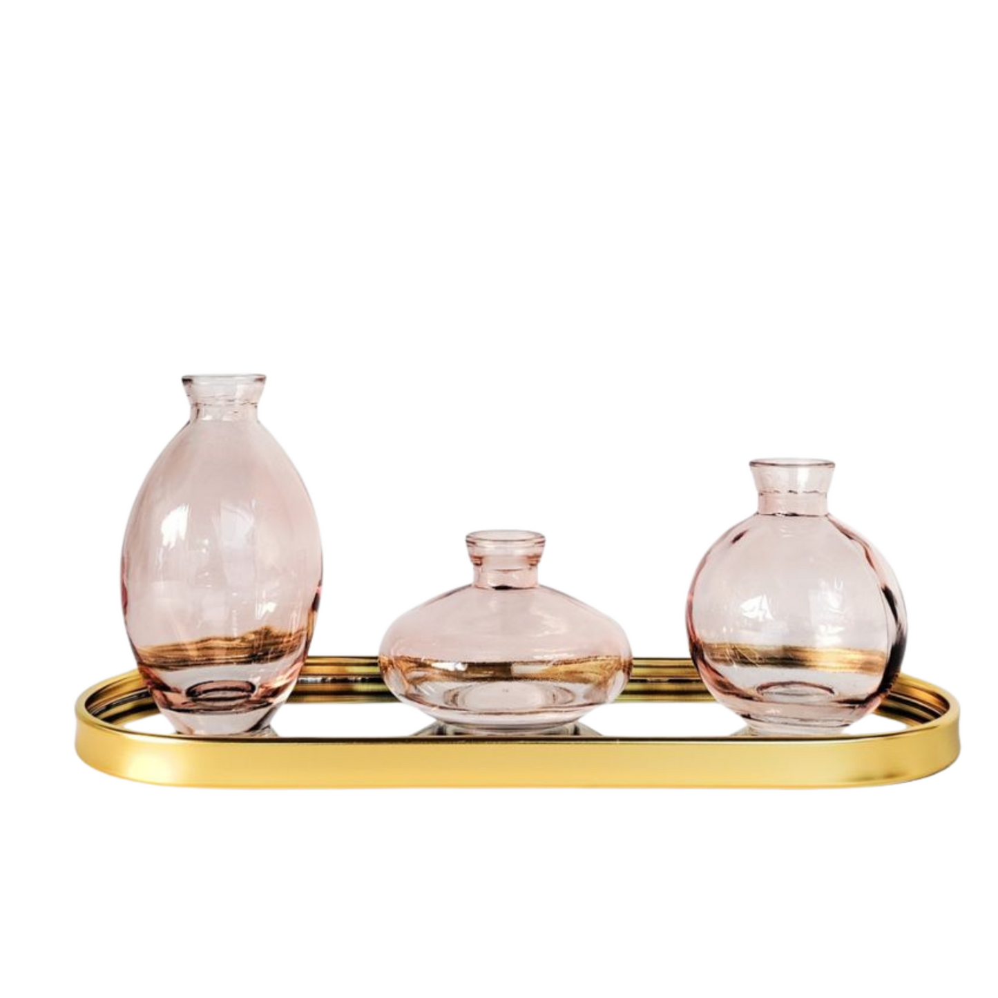 Set of three soft pink glass vases with a matching sleek tray, ideal for displaying flowers or as elegant stand-alone décor on a shelf or table.