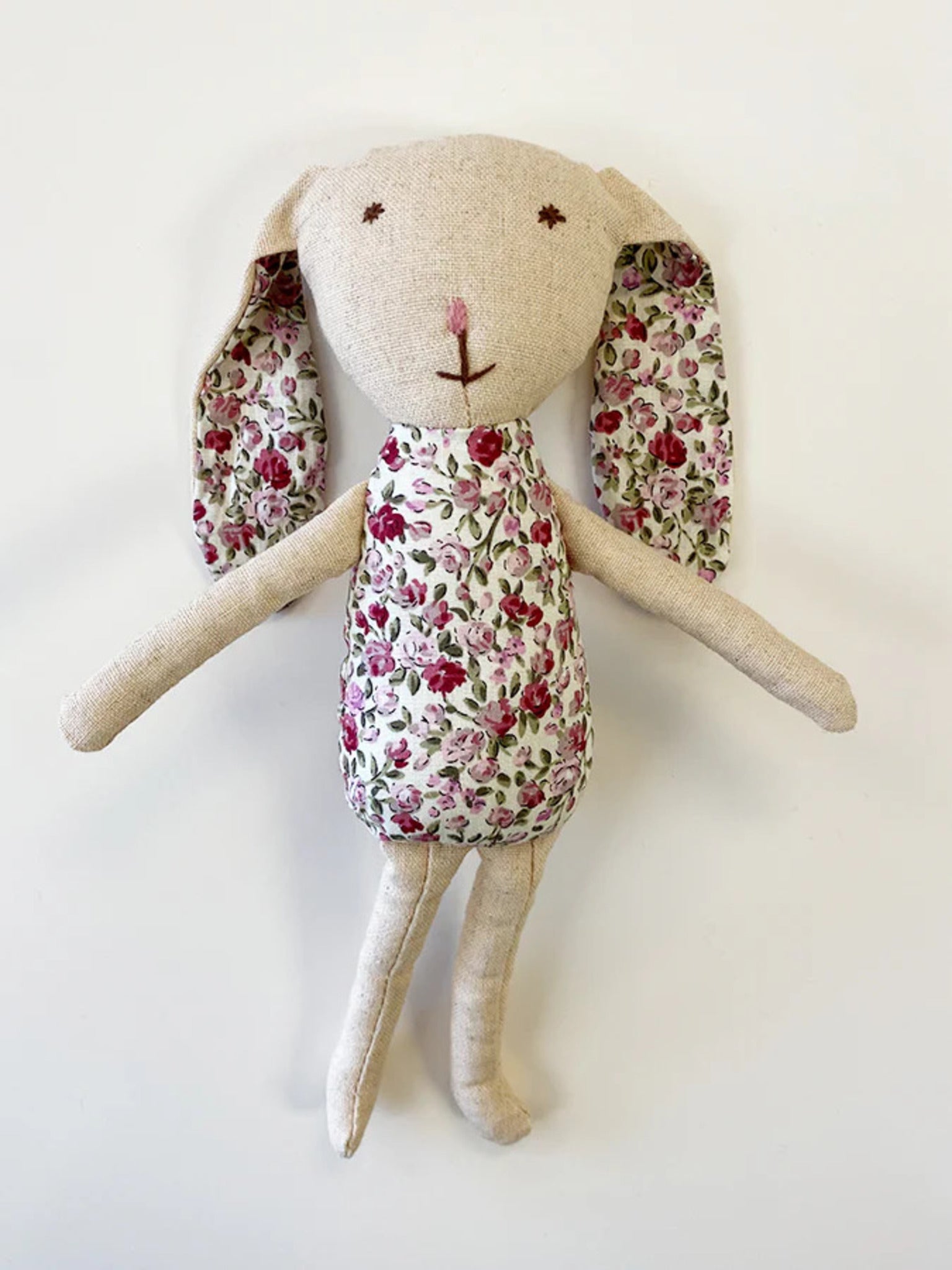Bonnie Bunny, 23 cm tall handmade linen toy with embroidered face, vintage floral fabric accents, cotton wadding, and a pink cotton pom-pom tail.