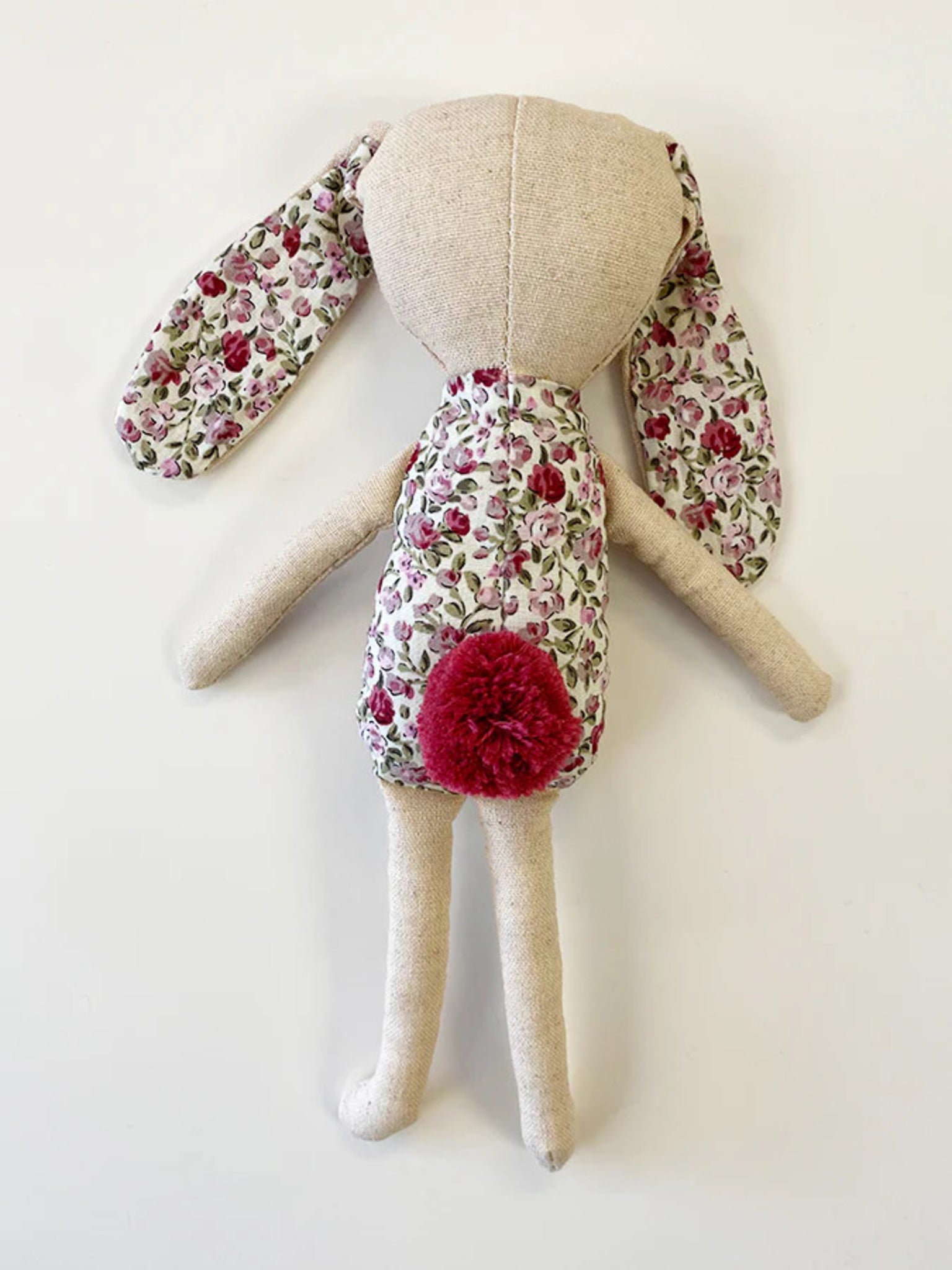 Bonnie Bunny, 23 cm tall handmade linen toy with embroidered face, vintage floral fabric accents, cotton wadding, and a pink cotton pom-pom tail.