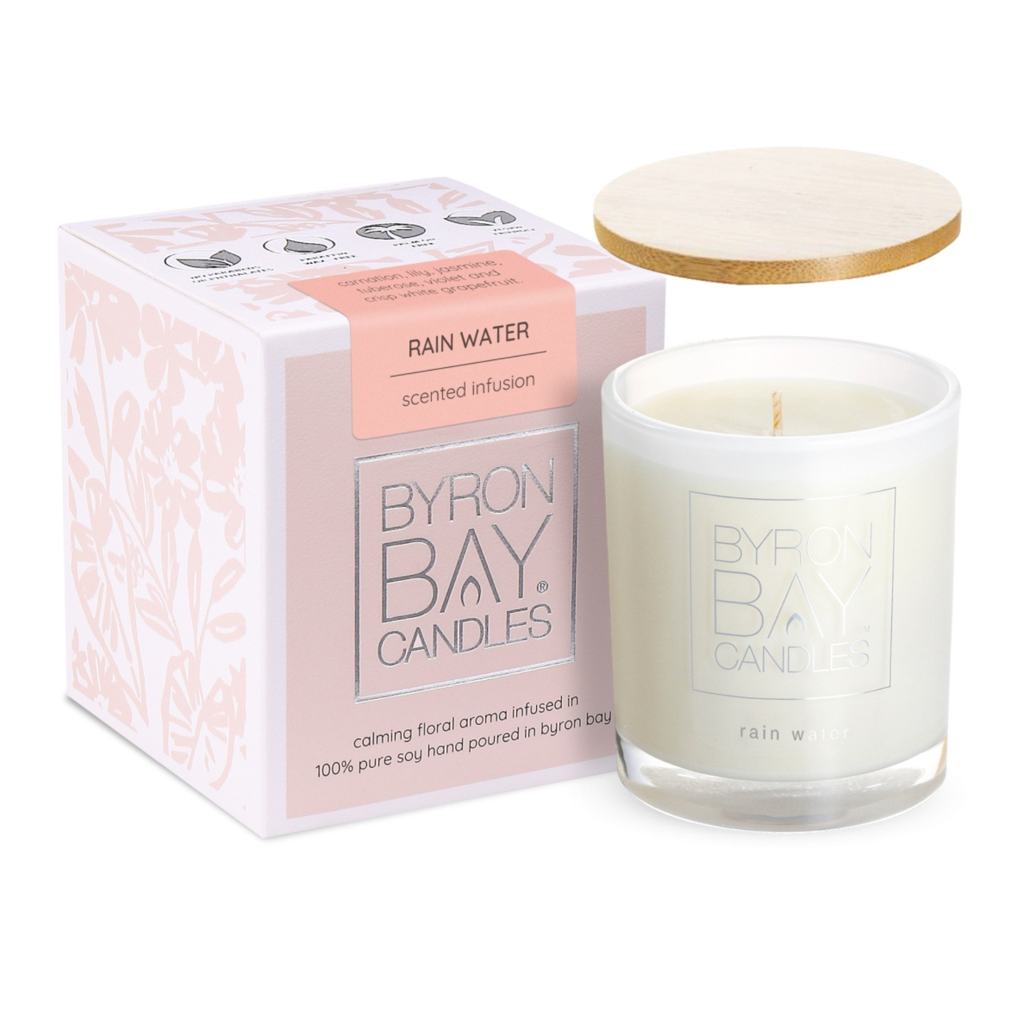 Rain Water medium soy candle, 75x75x85mm jar in soft neutral tones, hand-poured with 100% pure soy wax and cotton wick. Features floral and citrus scent with 30+ hours burn time, natural timber lid, and gift box.