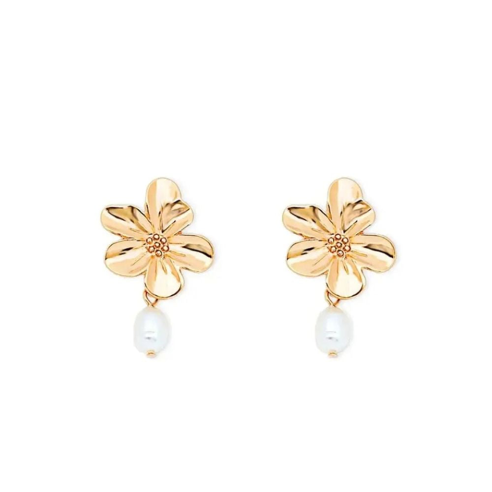 Gold flower-shaped earrings with pearl centers dangle