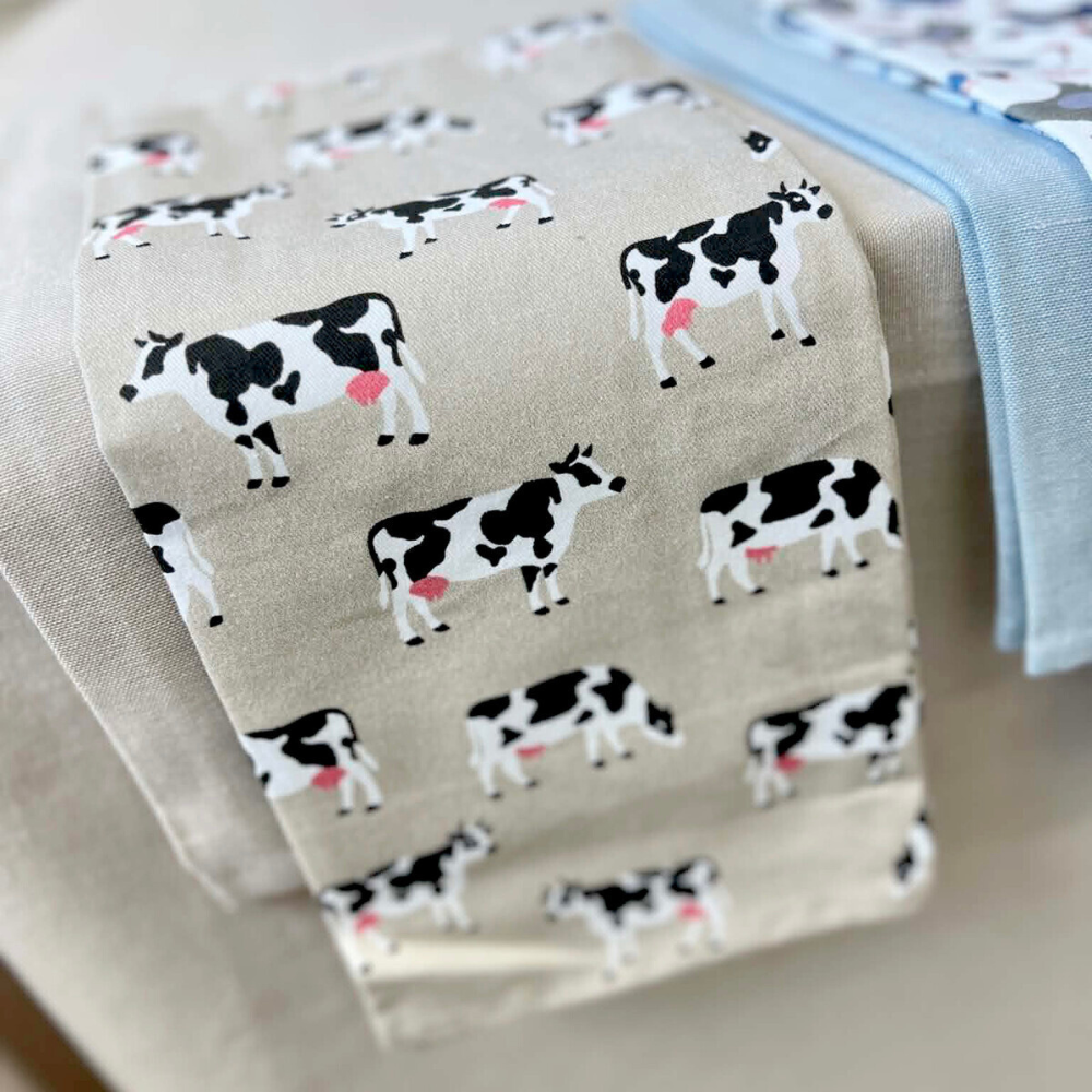 Fabric with cow pattern on a beige background