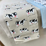 Fabric with cow pattern on a beige background