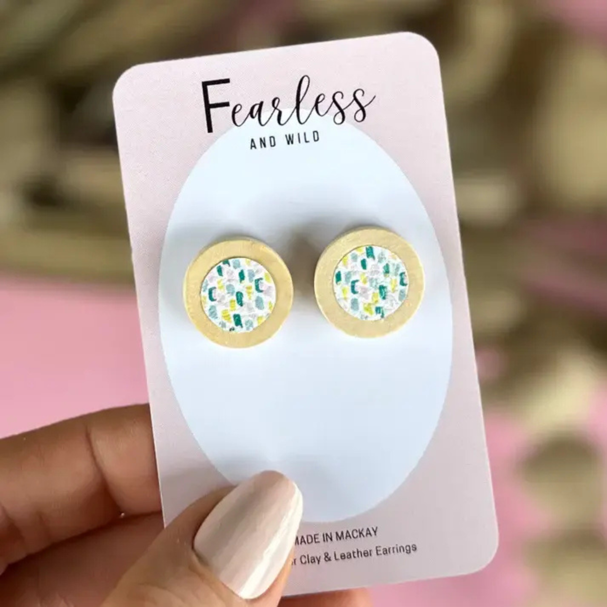 Garden Bloom round stud earrings featuring a vibrant floral leather design with timber cabochon and stainless steel posts—lightweight and ideal for sensitive ears.