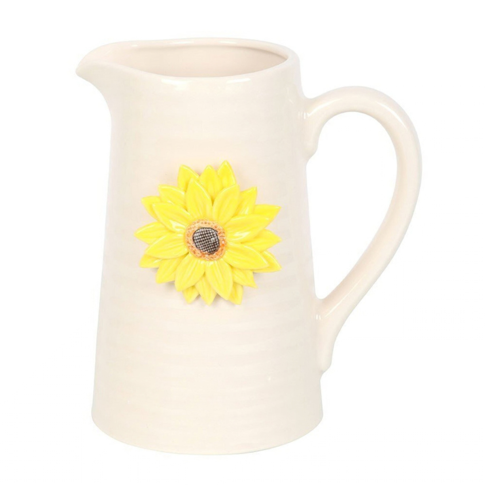 White ceramic pitcher with a yellow sunflower decoration on a white background