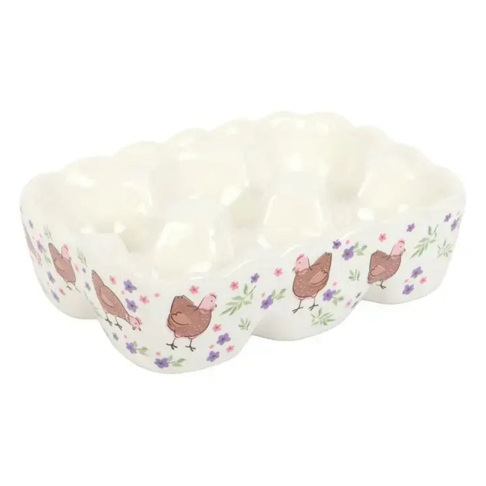 Chicken and floral print egg holder on a white ceramic holder