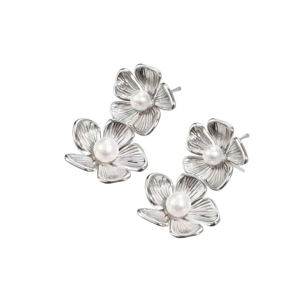 Silver flower-shaped earrings with pearl centers