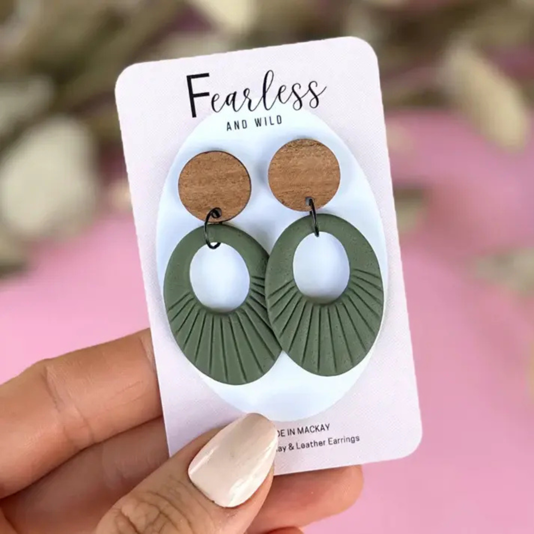 Curved khaki polymer clay earrings with a natural timber top and stainless steel posts—lightweight, stylish, and perfect for everyday wear and sensitive ears.