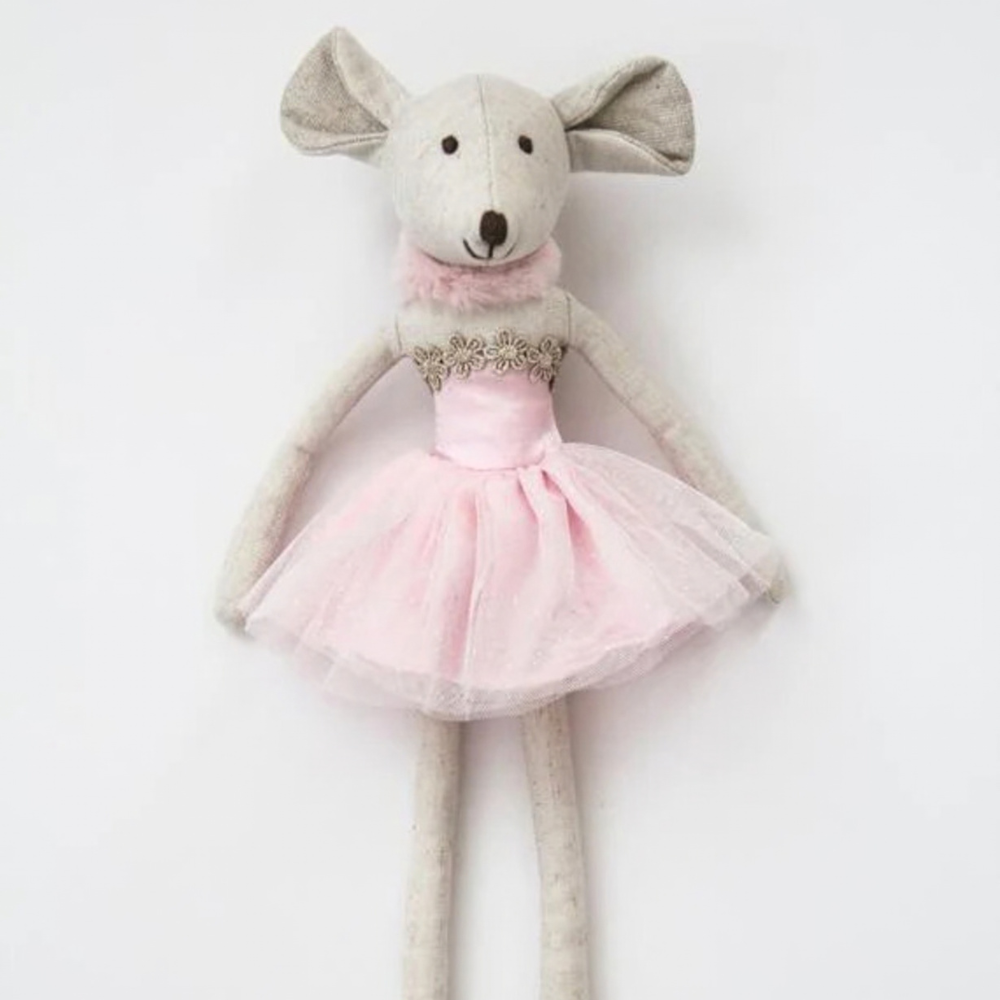 Stuffed toy mouse in a pink dress with decorative elements on a white background