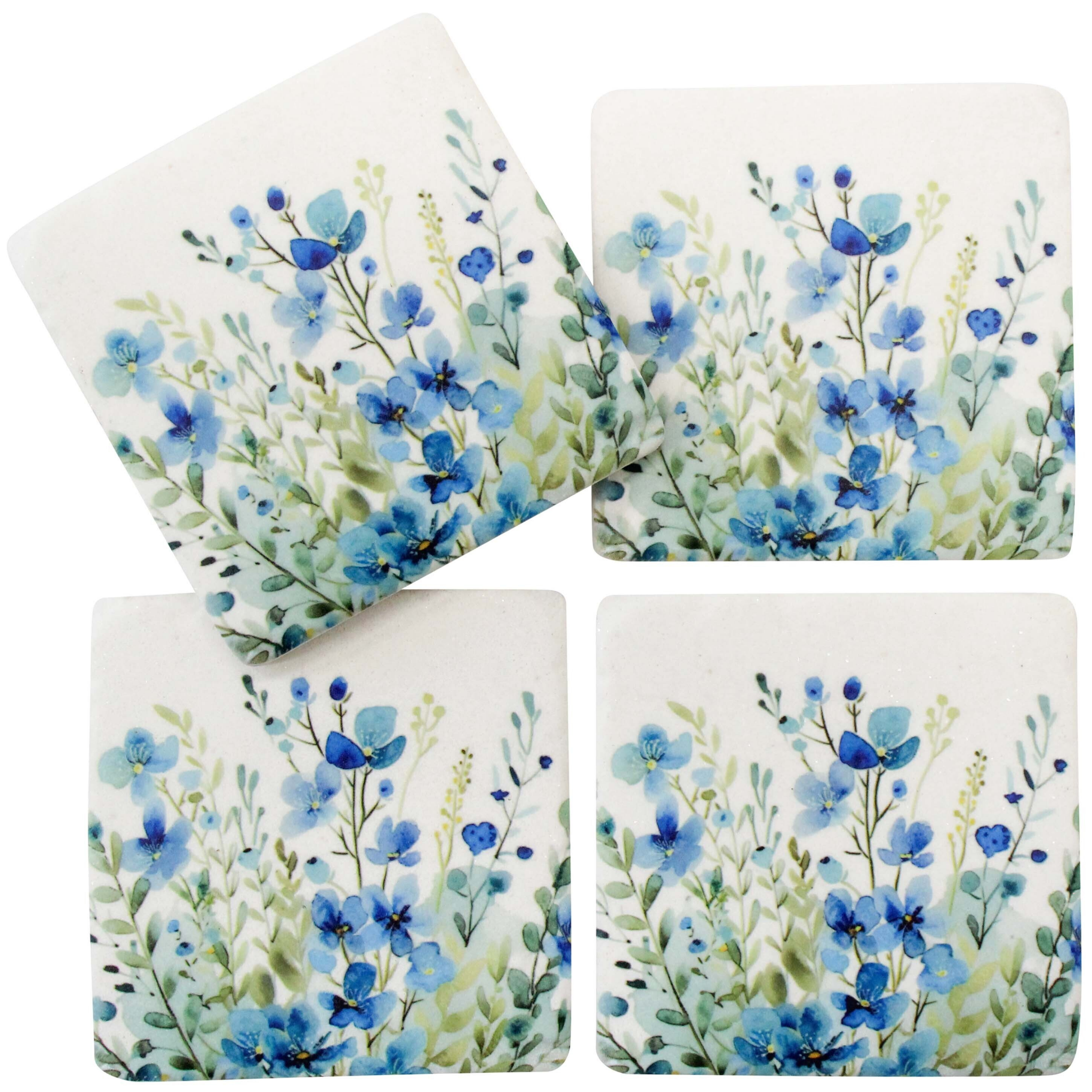 Set of four ceramic coasters featuring soft blue floral watercolour designs, each 9.5 x 9.5 cm, ideal for protecting tables with a decorative touch.