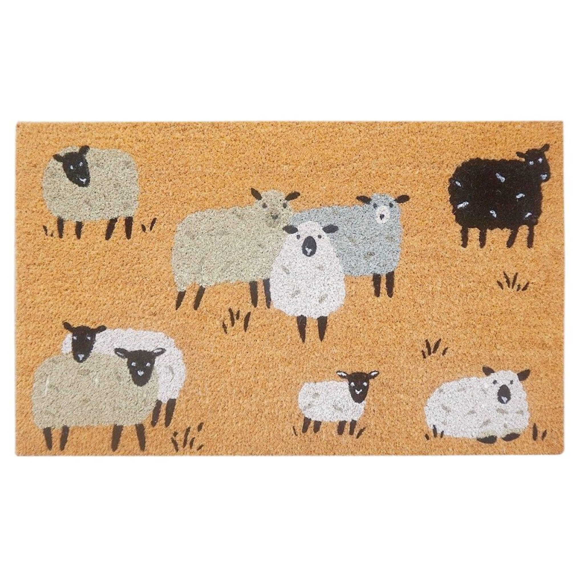 Rectangular coir door mat featuring a black and white sheep design on a natural background, designed to trap dirt and add a cosy, countryside touch to entryways.